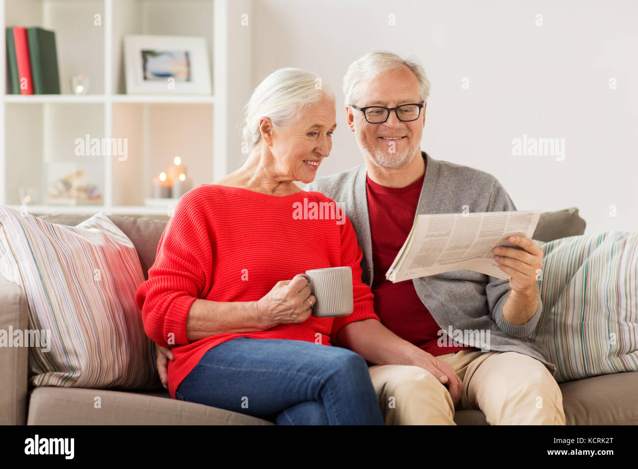 happy senior couple reading newspaper at christmas Stock Photo