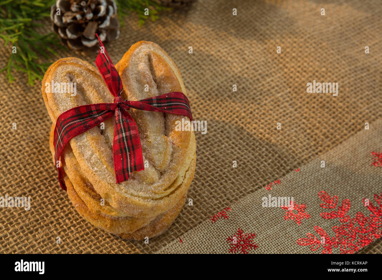 Close up of baked food tied with ribbon on burlap Stock Photo - Alamy