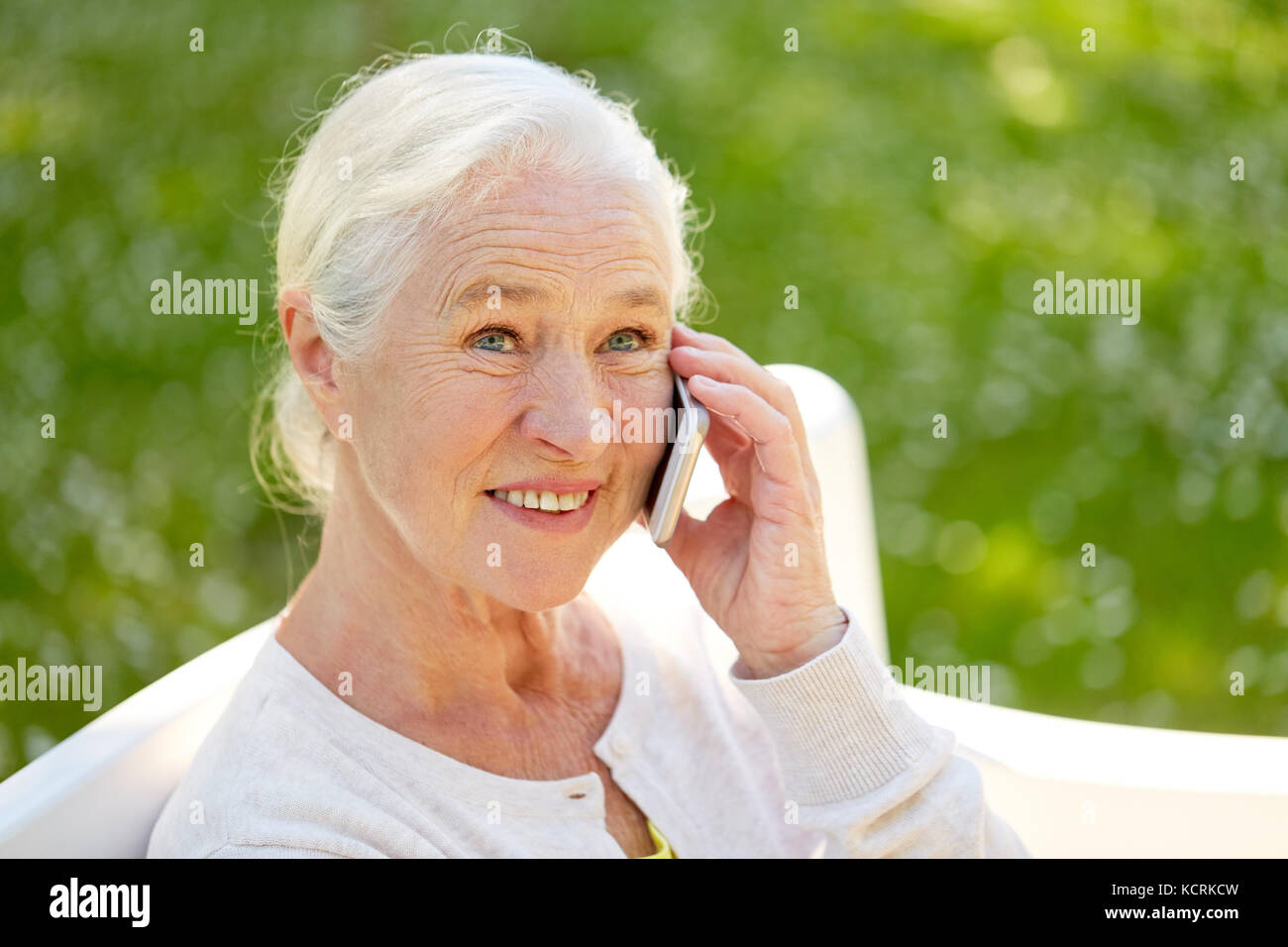 happy senior woman calling on smartphone in summer Stock Photo