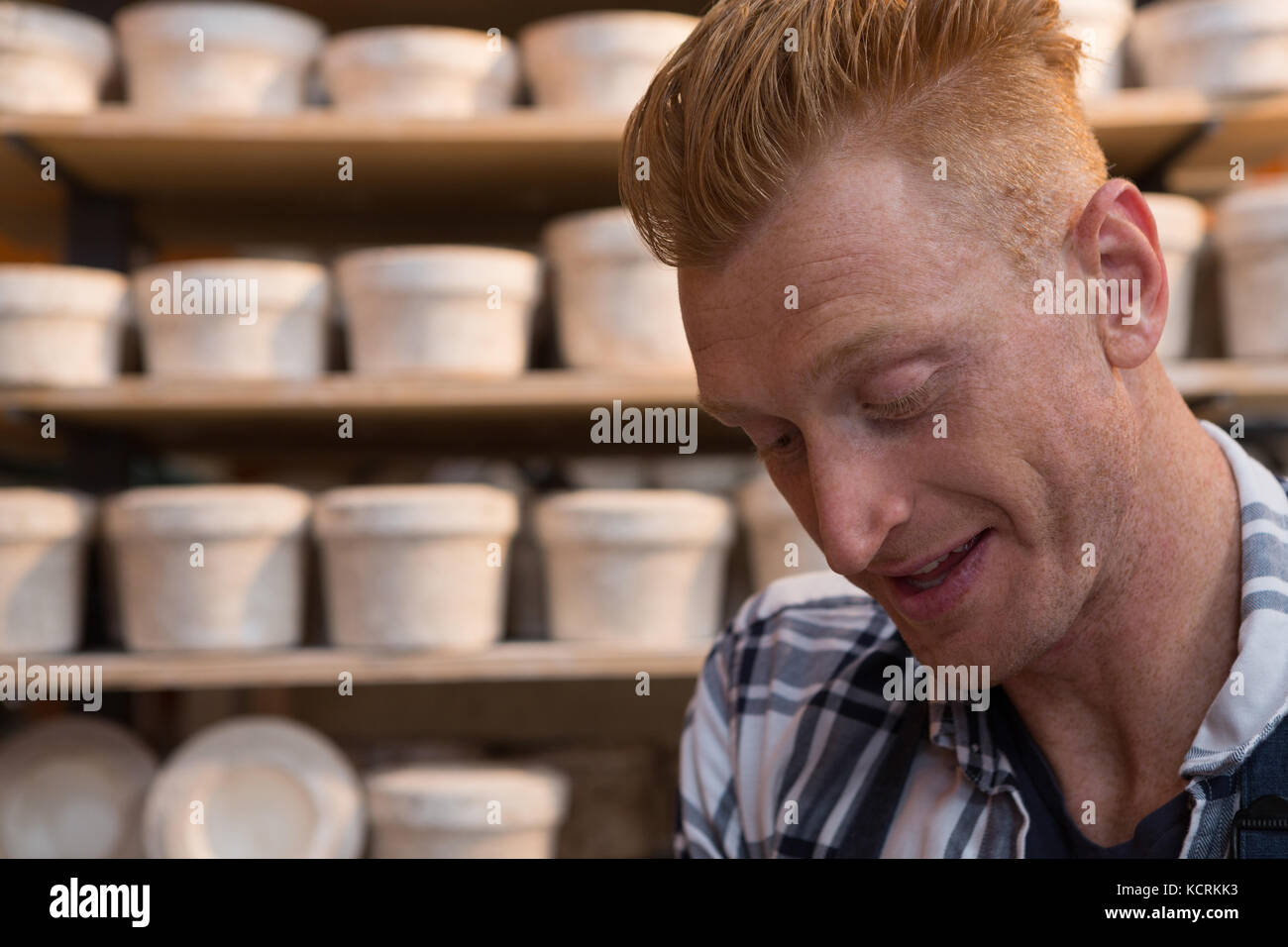 Male potter working in pottery workshop Stock Photo - Alamy