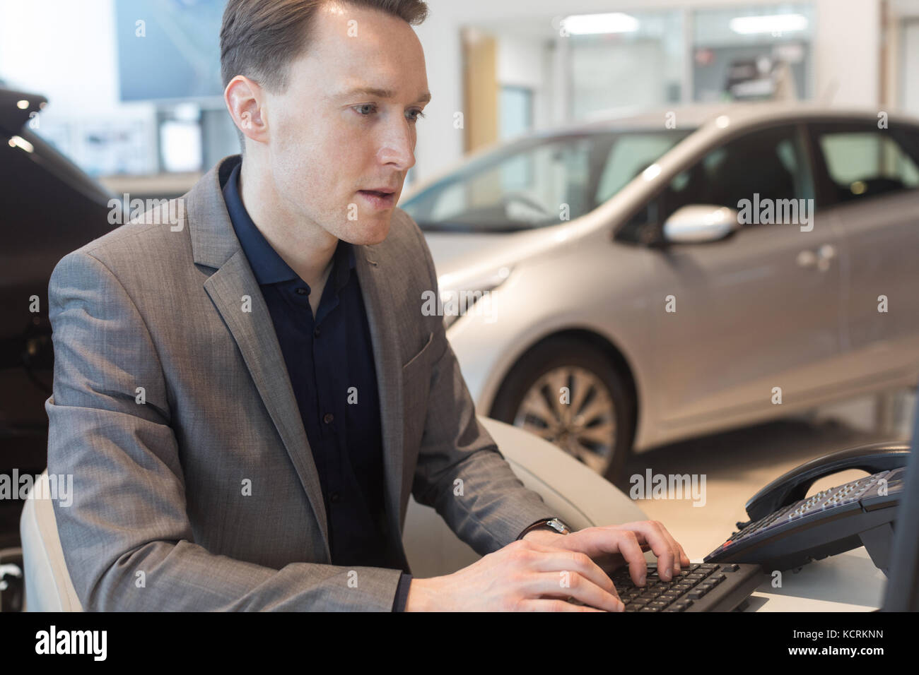 Car Salesman Sitting Desk In High Resolution Stock Photography and