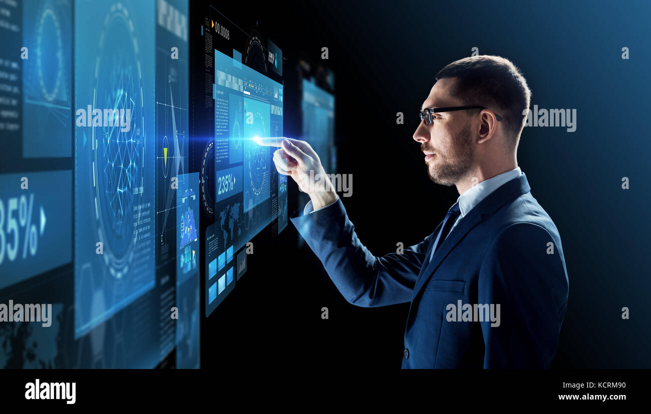 businessman in glasses with virtual projection Stock Photo - Alamy