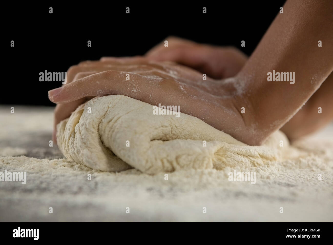 Close-up of woman kneading a dough Stock Photo - Alamy