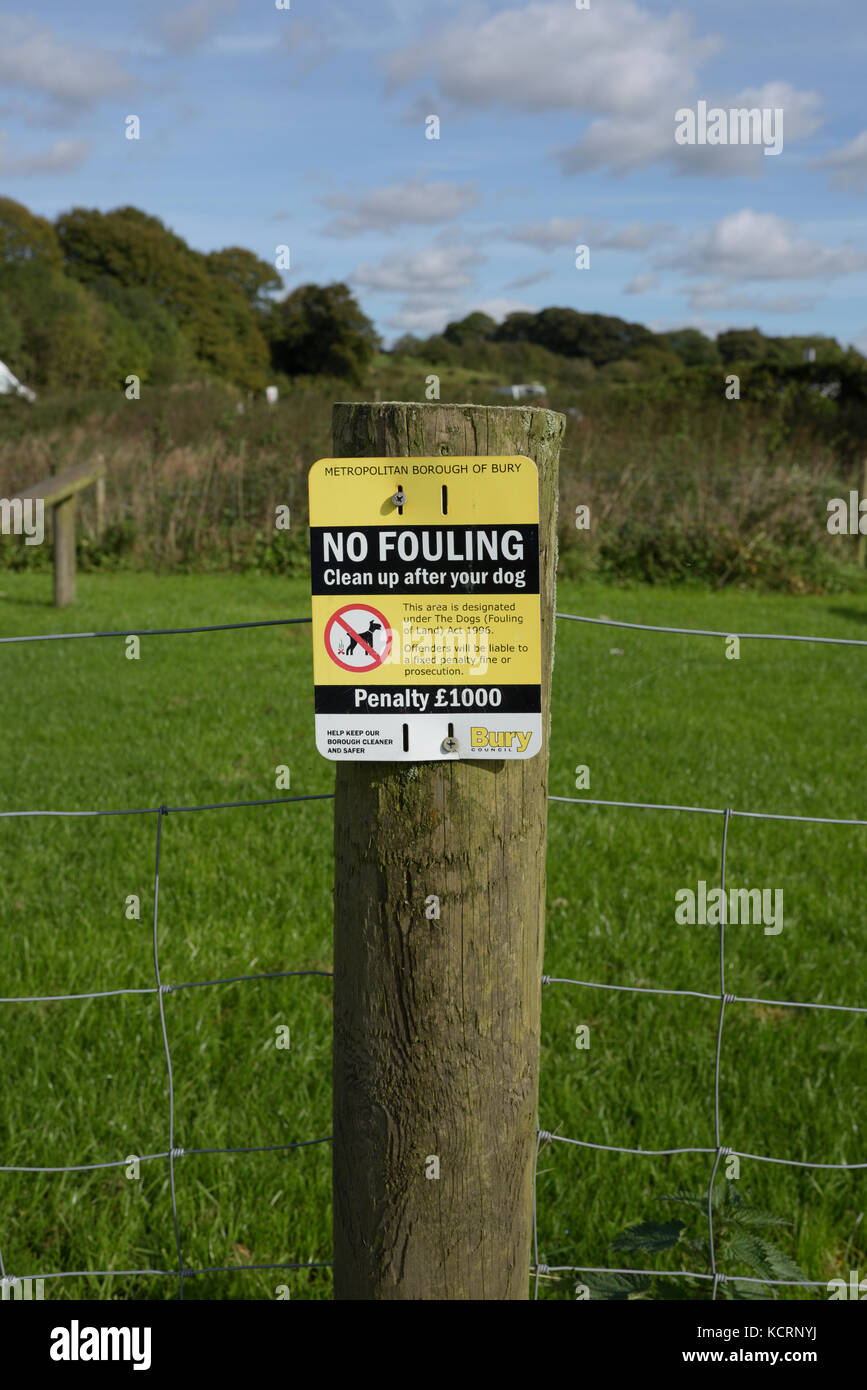 No fouling sign on wooden fence post in Burrs country park bury lancashire uk Stock Photo