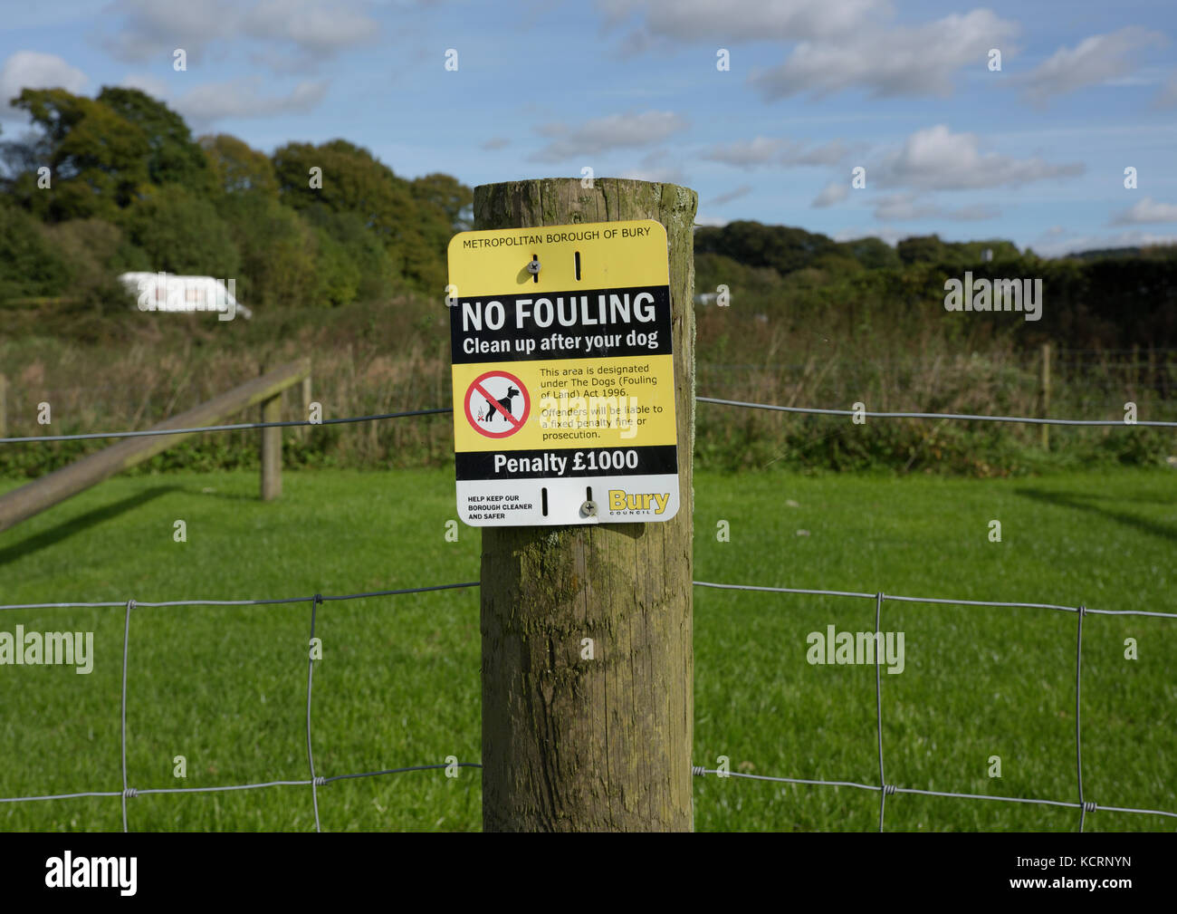 No fouling notice on wooden fence post in Burrs country park bury lancashire uk Stock Photo