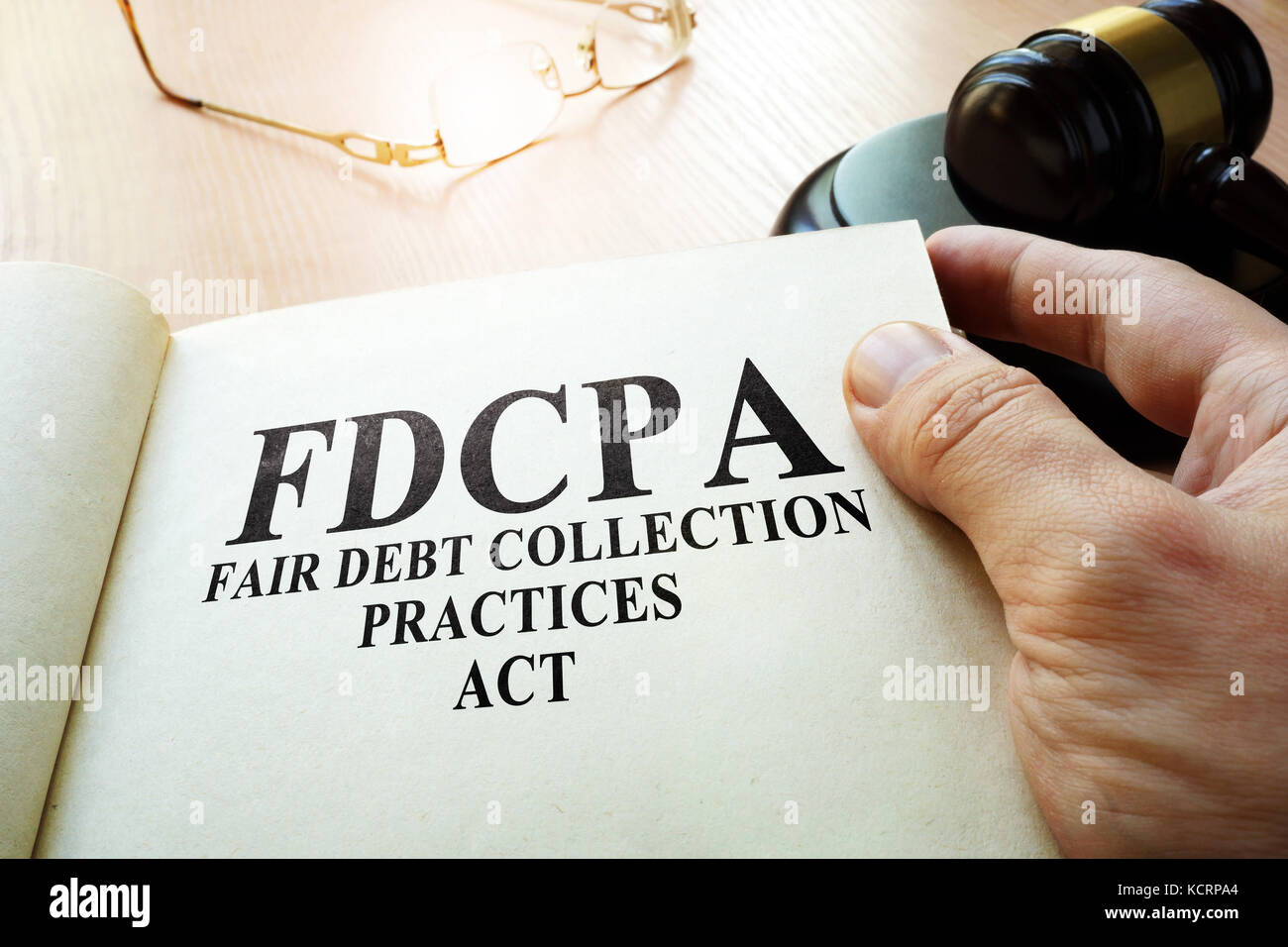 Fair Debt Collection Practices Act FDCPA on a table. Stock Photo