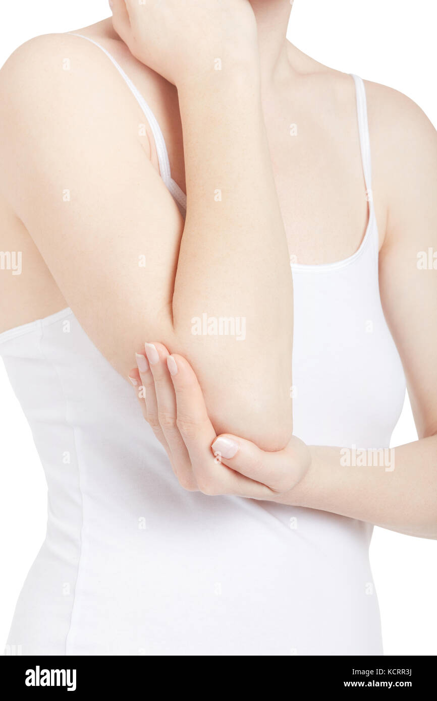Young woman with white shirt holding arm and elbow in pain isolated on white, clipping path Stock Photo
