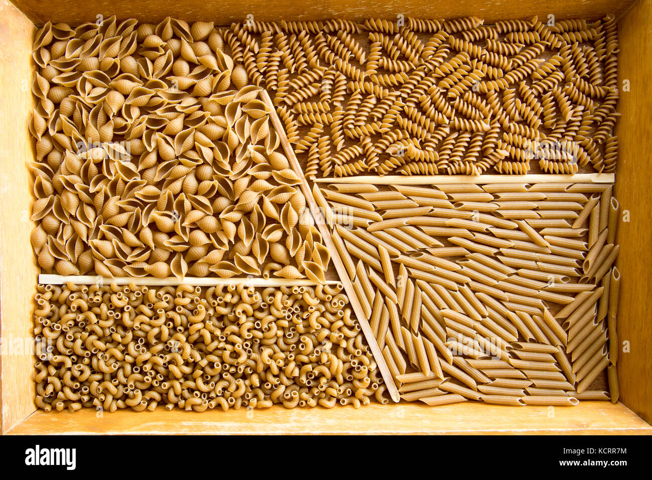 Assortment of whole wheat pasta including shells, rotini, penne and