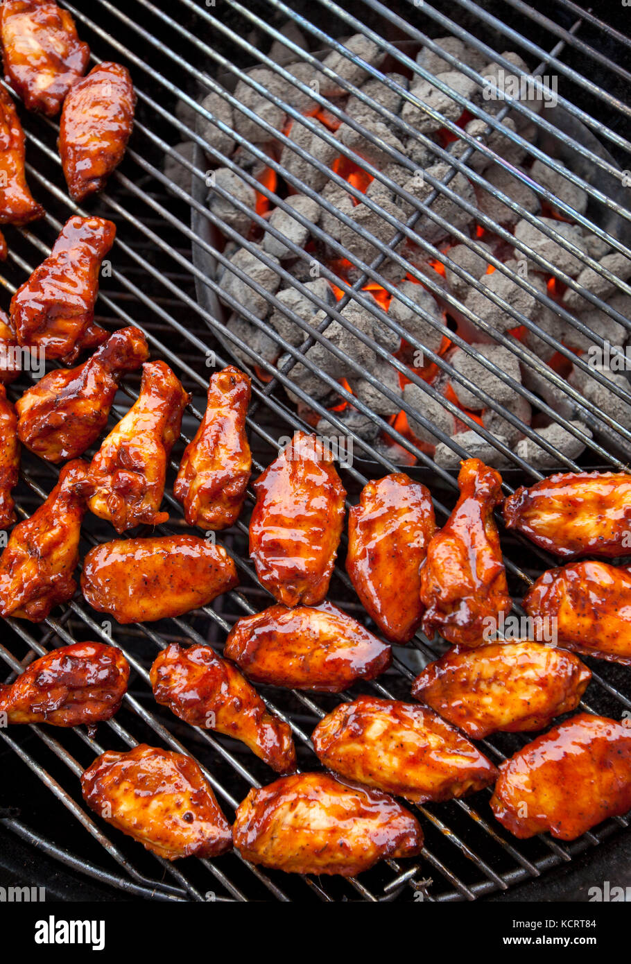 Marinated chicken wings grilling over hot charcoal Stock Photo Alamy