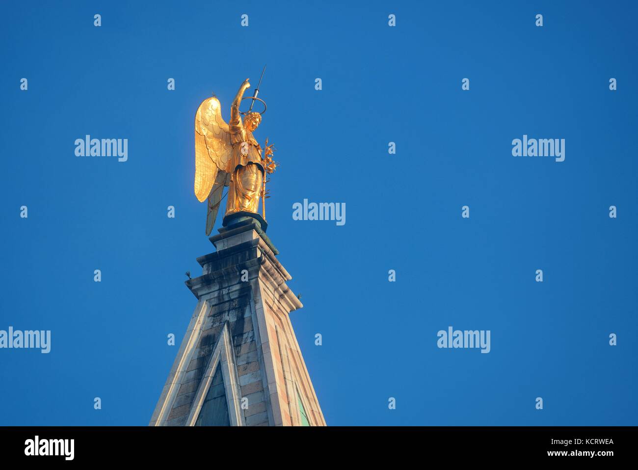 Golden statue of angel on top of clock tower in St Mark's Square, Venice, Italy. Stock Photo