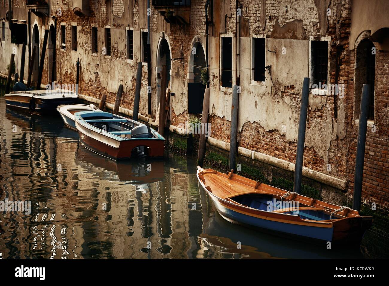 Boat park in Venice alley canal. Italy Stock Photo - Alamy