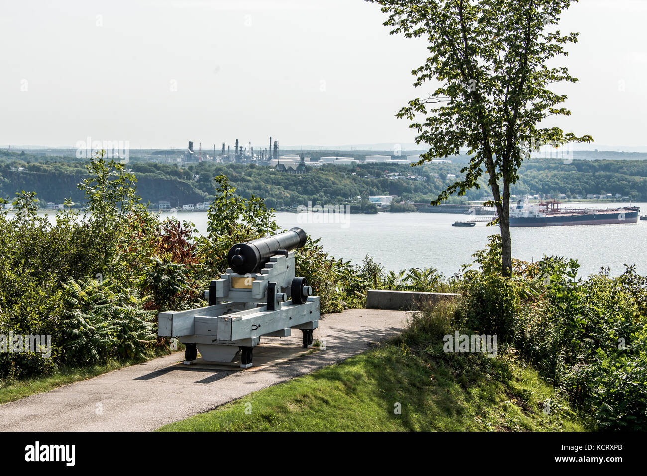 Cannon in Quebec City Canada - plaines Abraham overlooking Saint Lawrence river and Jean-Gaulin Refinery in Levis town Stock Photo