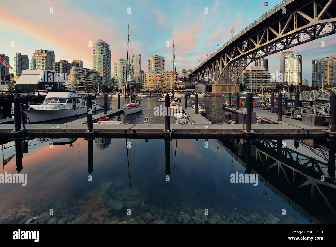 Vancouver False Creek at sunset with bridge and boat Stock Photo - Alamy