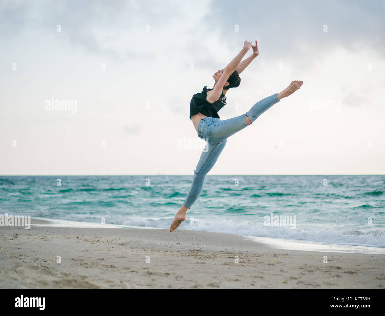 Ballerina jumping in river Stock Photo - Alamy