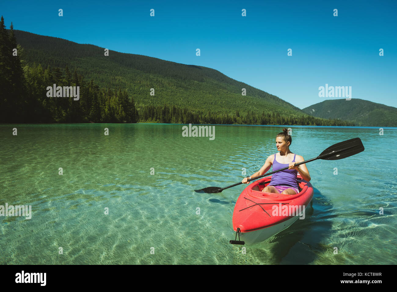 Kayaking in crystal clear tropical hi-res stock photography and images ...