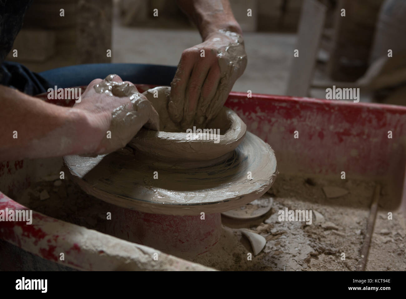 Male potters hand making a pot in pottery Stock Photo Alamy