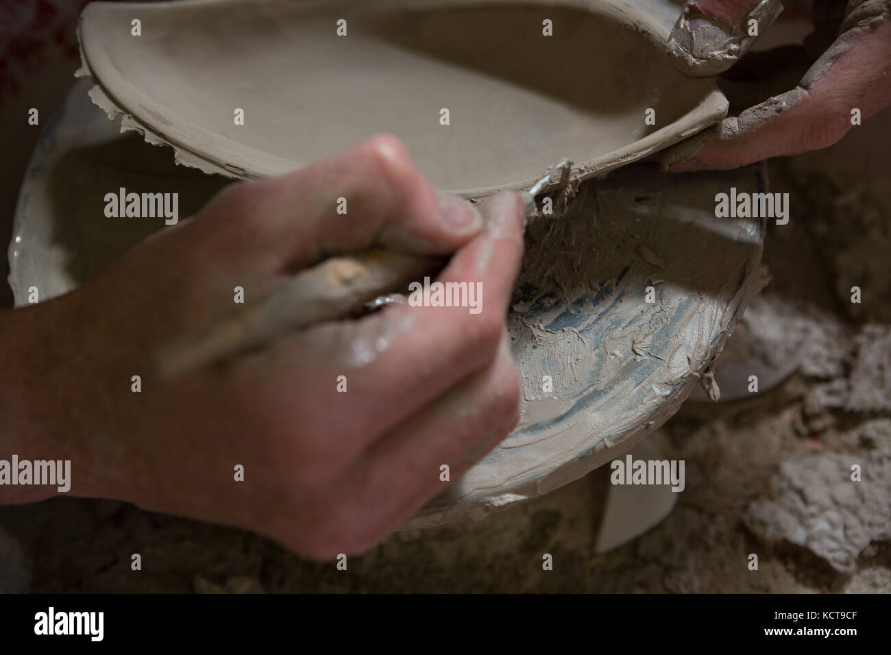 Male potters hand making a bowl in pottery workshop Stock Photo - Alamy