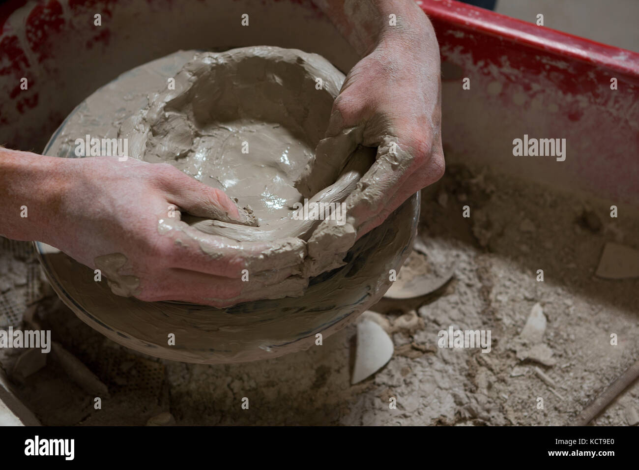 Male potters hand making a pot in pottery Stock Photo Alamy