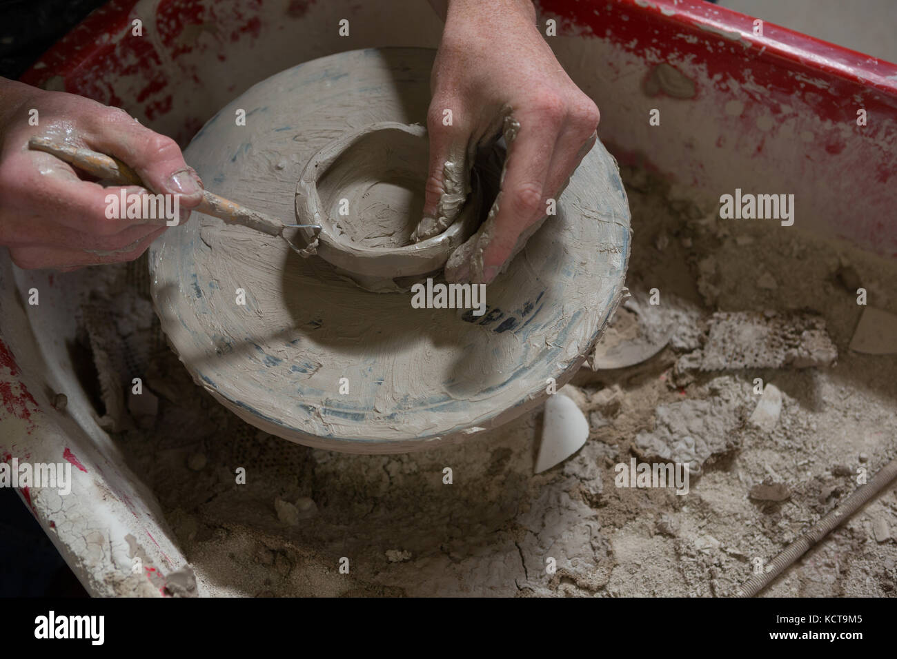 Male potters hand making a bowl in pottery workshop Stock Photo - Alamy