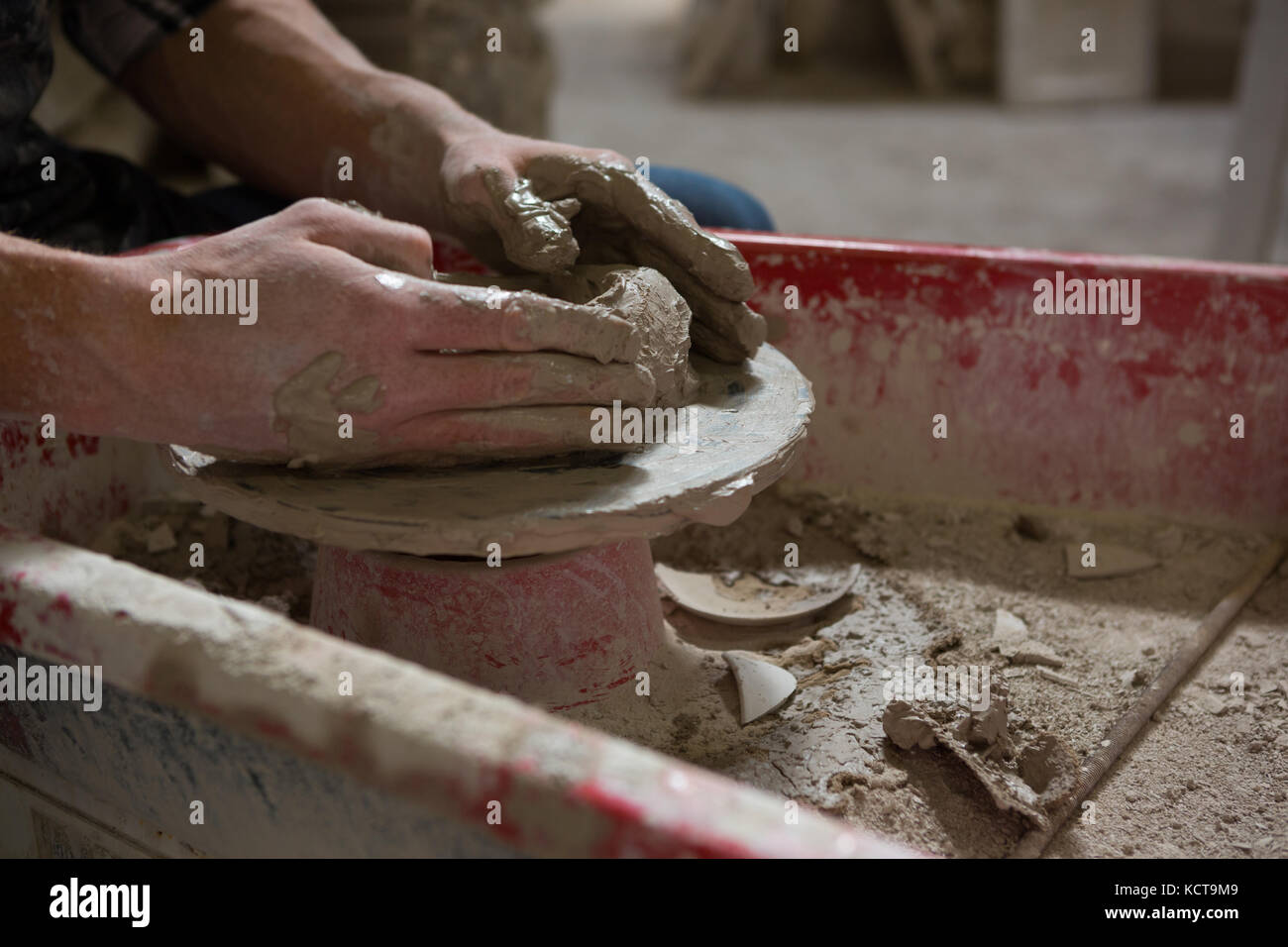 Male potters hand making a pot in pottery workshop Stock Photo - Alamy