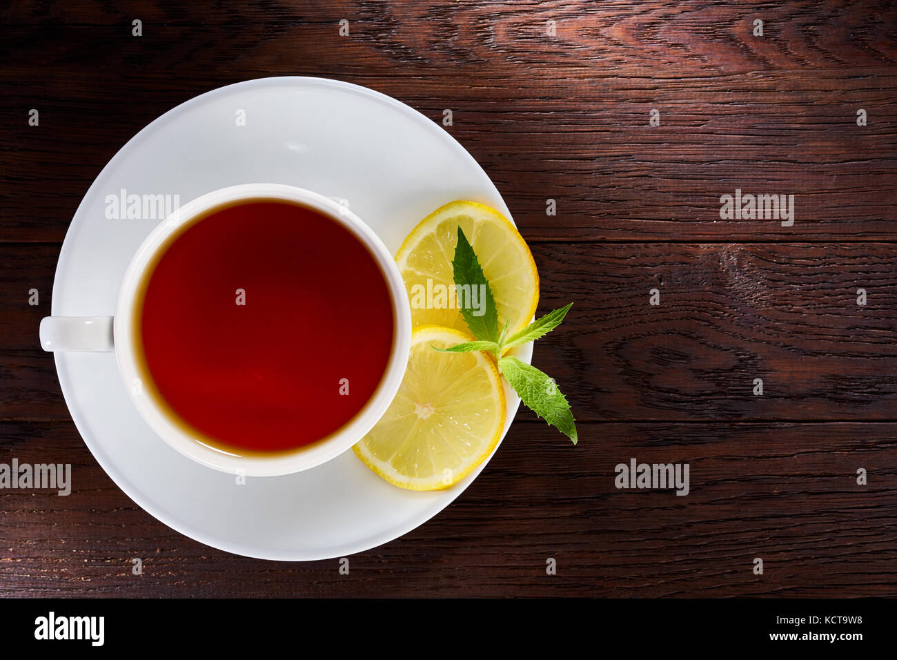 Hot earl grey tea with lemon slice top view on wood table background ...