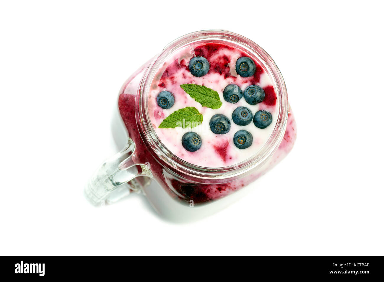 Jar of blueberry smoothie on white Stock Photo