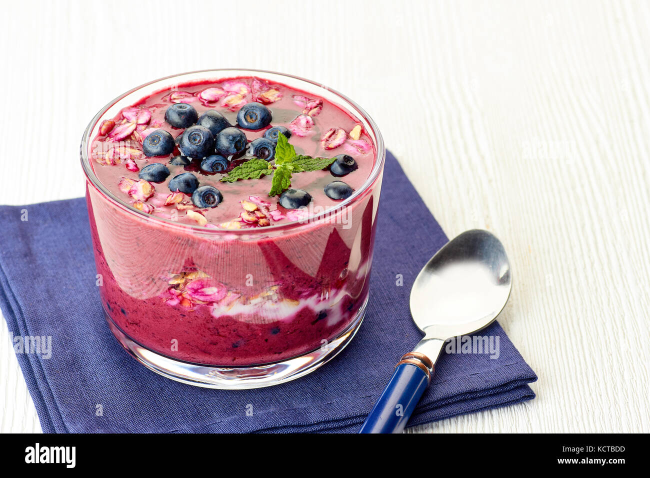 Yogurt dessert with blueberries and muesli Stock Photo Alamy