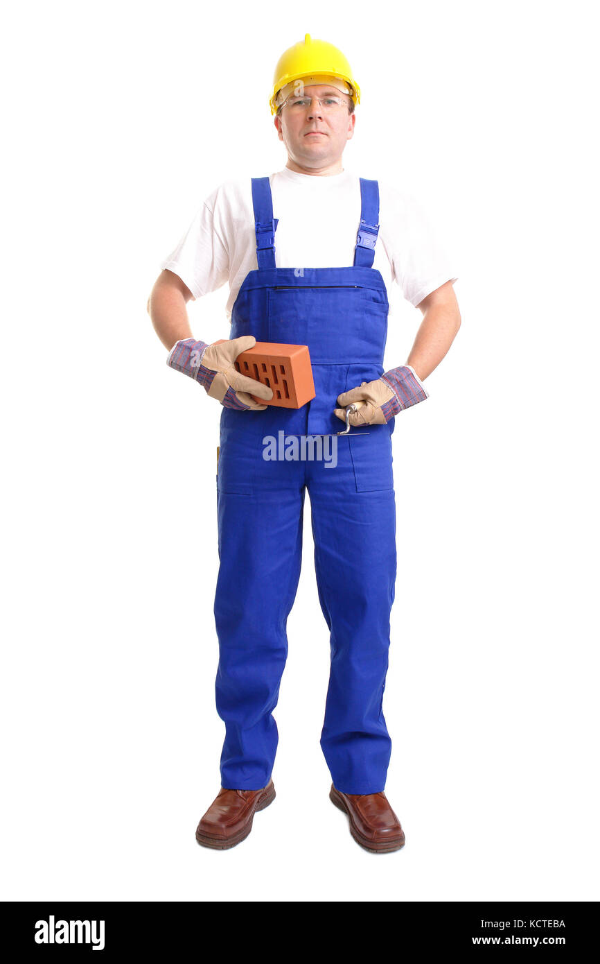 Construction worker wearing blue jumpsuit and yellow helmet posing with  stainless steel trowel and brick over white background Stock Photo - Alamy