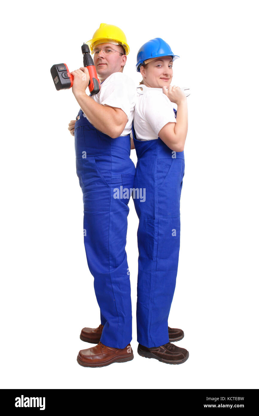 Serviceman and servicewoman wearing yellow and blue helmet and blue overall facing their backs to each other - man holding borer - woman holding flat  Stock Photo