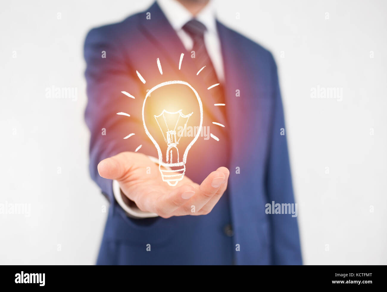 Businessman with idea light bulb Stock Photo