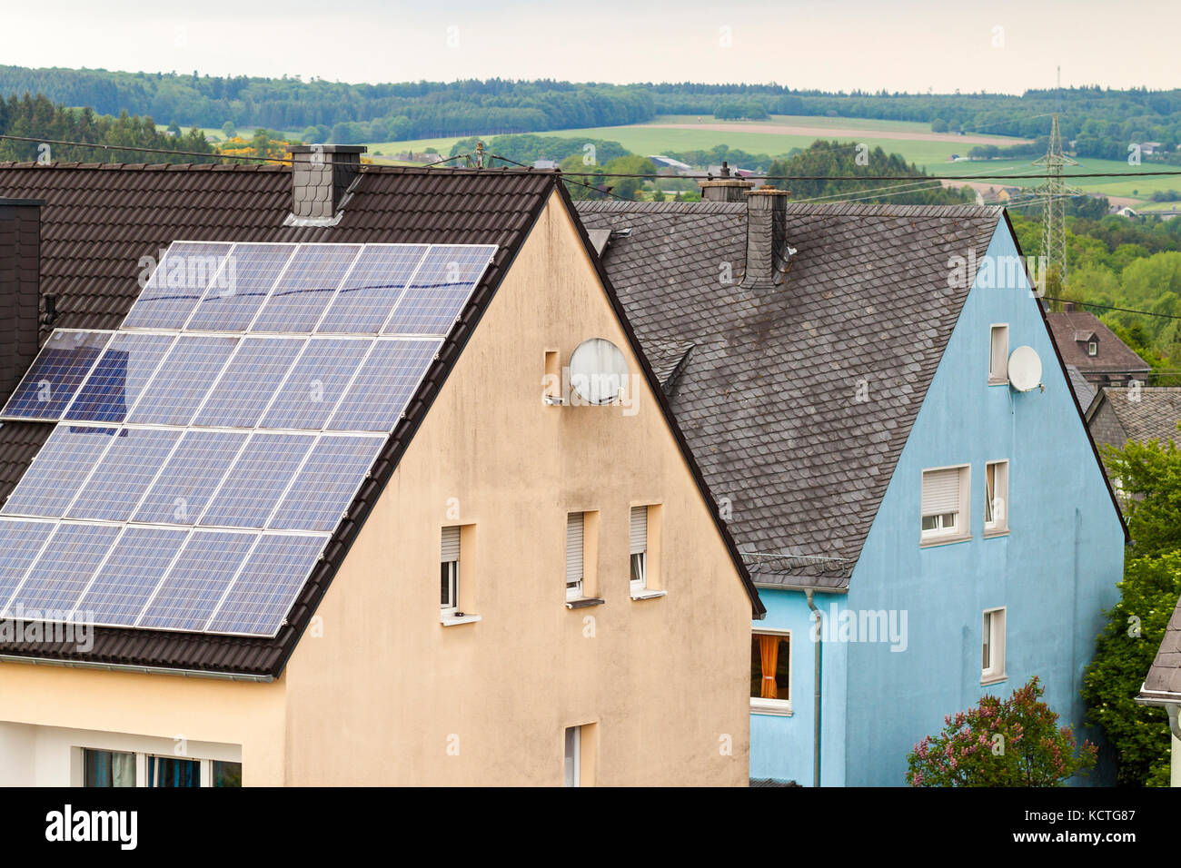 Renewable clean green energy saving efficient solar panels on suburban ...