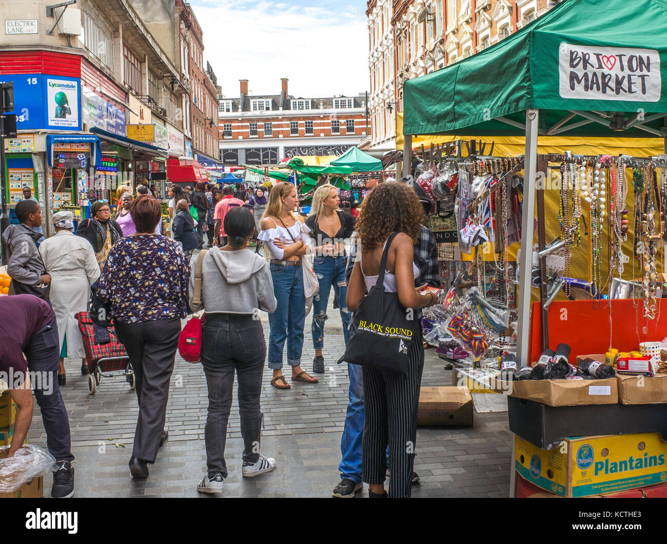 Busy and vibrant Brixton Market in fashionable area of south west London. Stock Photo