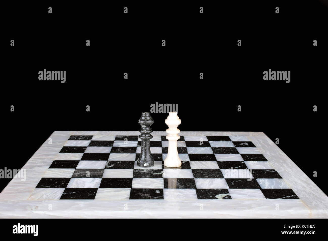 Who is the winner. King vs king on a marble chess board Stock Photo Alamy