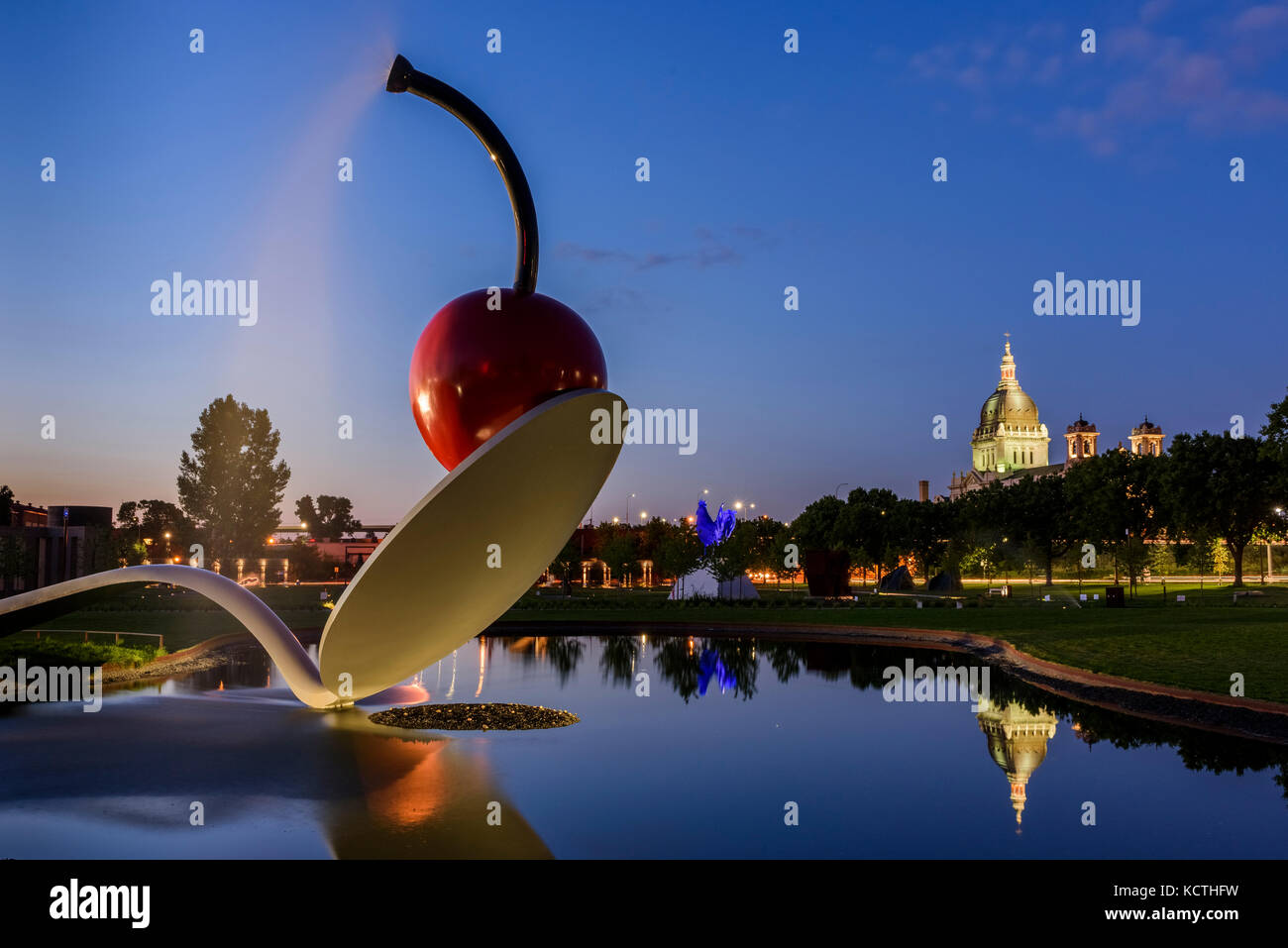 Spoonbridge and Cherry sculpture with the  Basilica of Saint Mary. Stock Photo