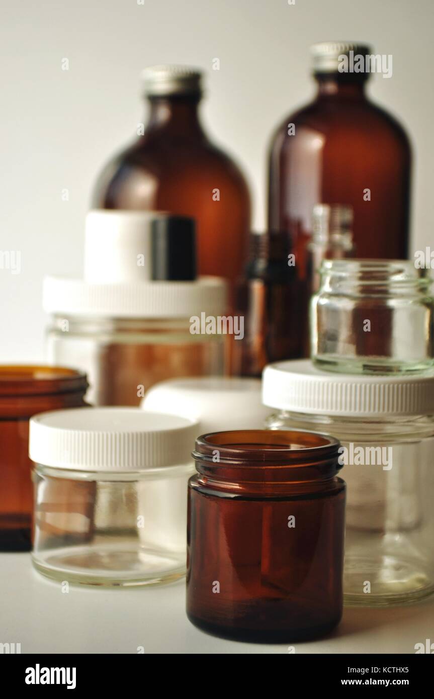 Clear and brown laboratory glass jars and bottles. Containers for