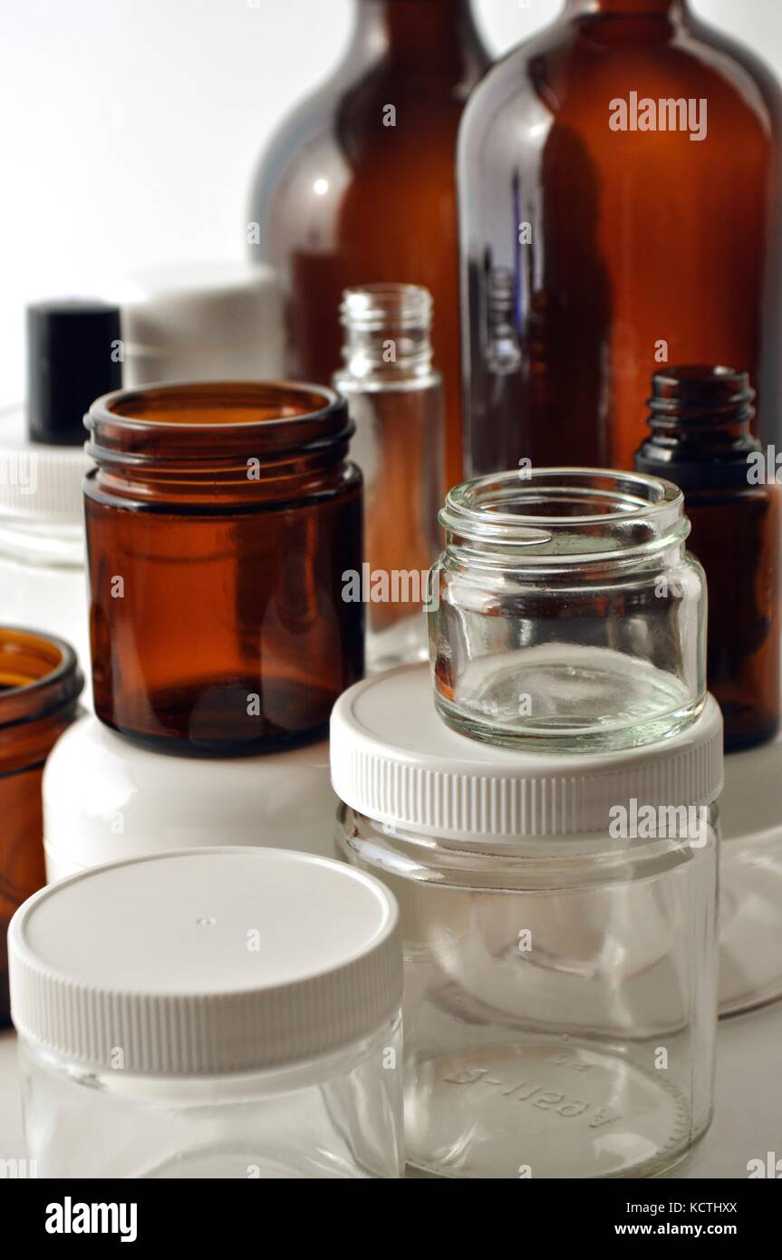 Clear and brown laboratory glass jars and bottles. Containers for essential  oils, cosmetics, medication, oils, liquids, creams and lotions Stock Photo  - Alamy