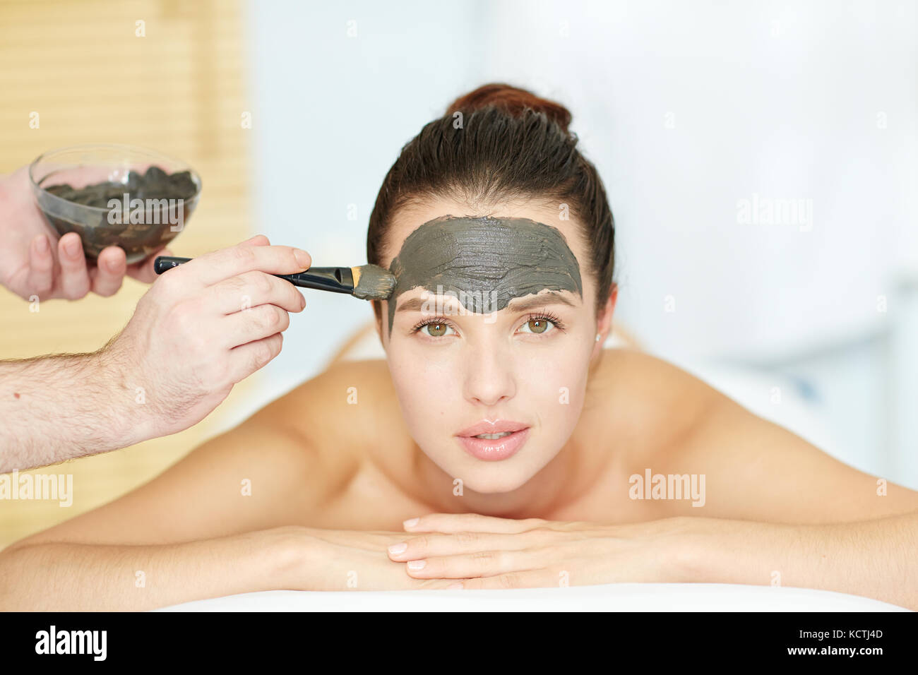 Having clay mask Stock Photo - Alamy