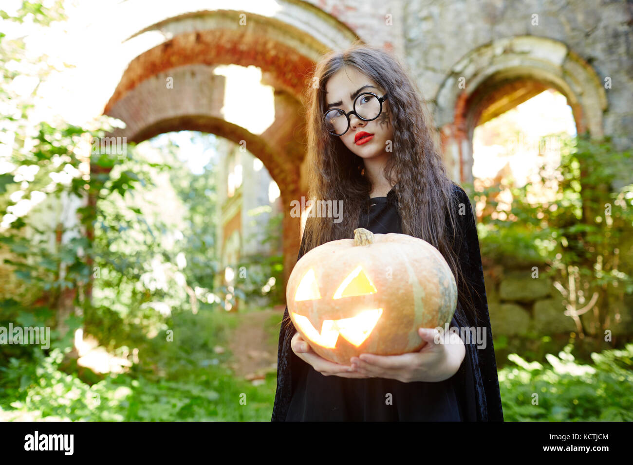 Halloween child with pumpkin Stock Photo - Alamy