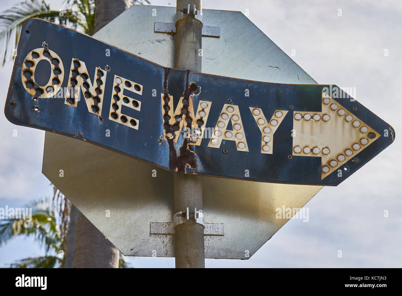 vintage metal street sign made out of two metal pieces rivitted