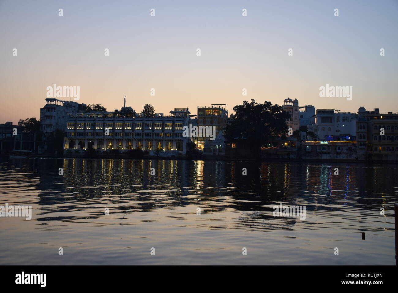 Amazing view of Udaipur skyline at sunset from lake Pichola Rajasthan