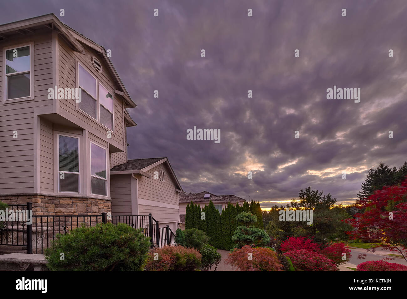 Stormy cky over North American suburbs neighborhood in fall season Stock Photo