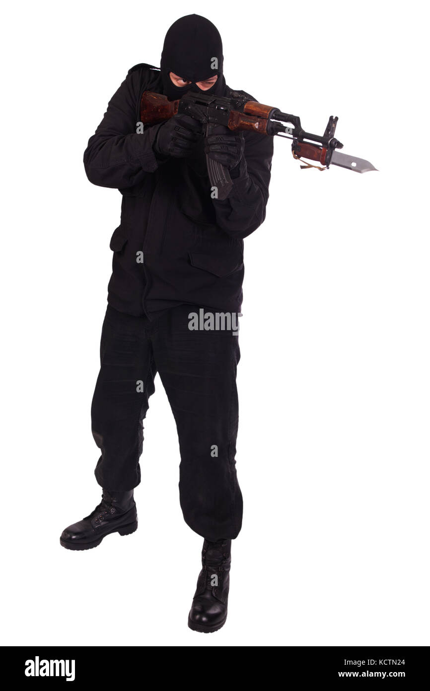 man in black uniform and mask with AK 47 gun Stock Photo - Alamy