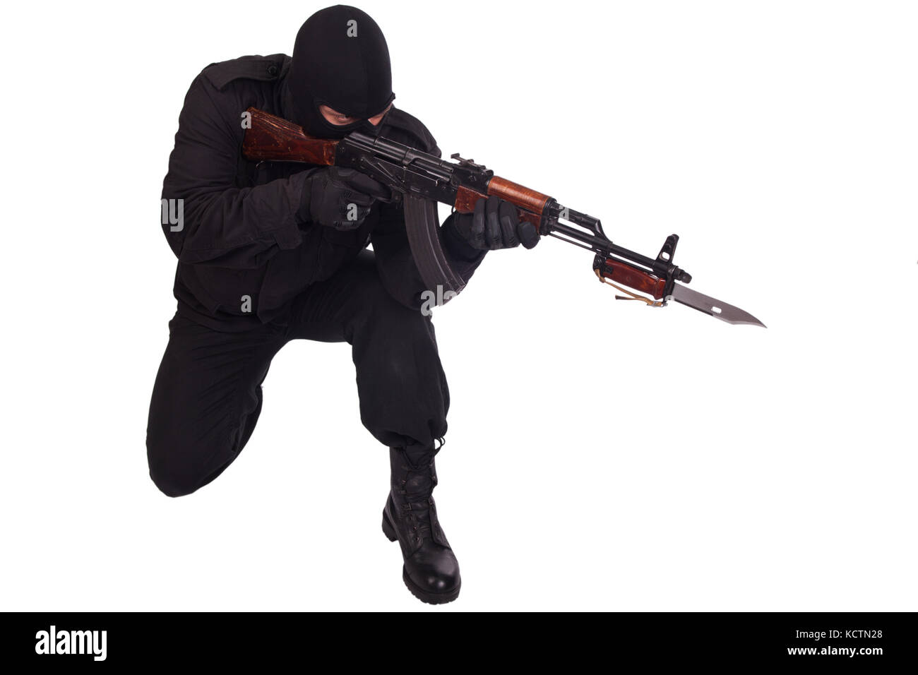 man in black uniform and mask with AK 47 gun Stock Photo - Alamy