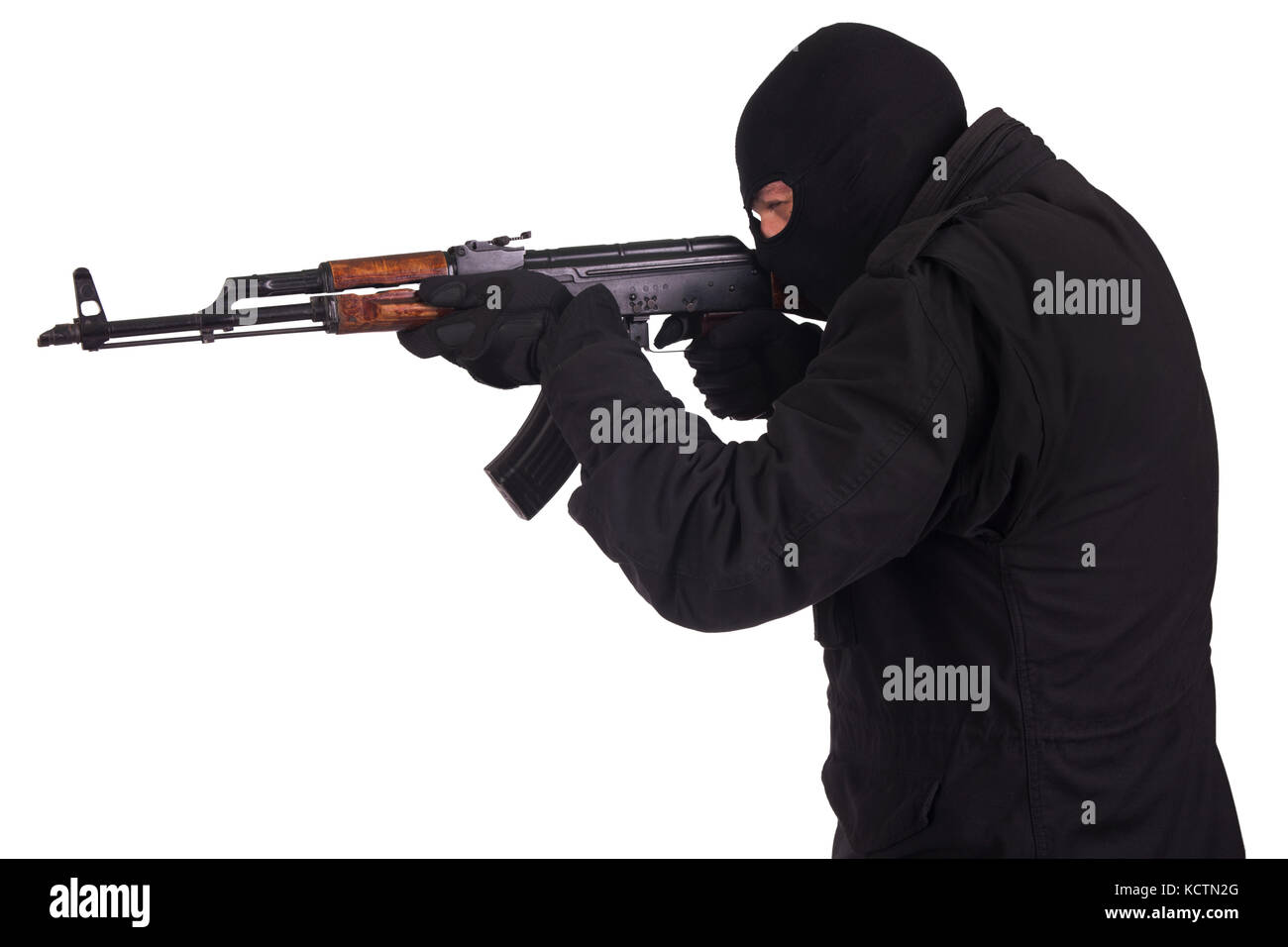 man in black uniform and mask with AK 47 gun Stock Photo - Alamy