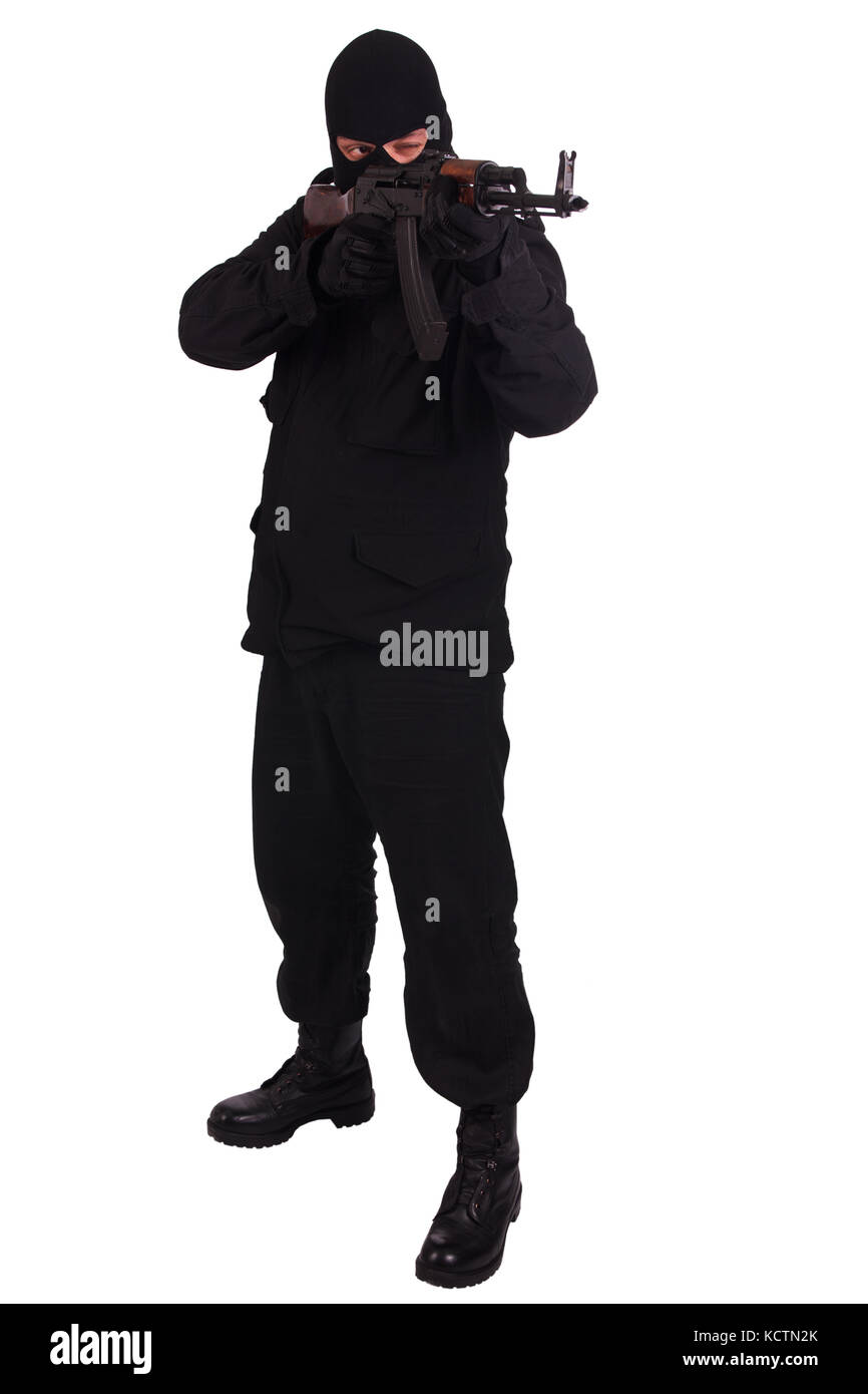 man in black uniform and mask with AK 47 gun Stock Photo - Alamy