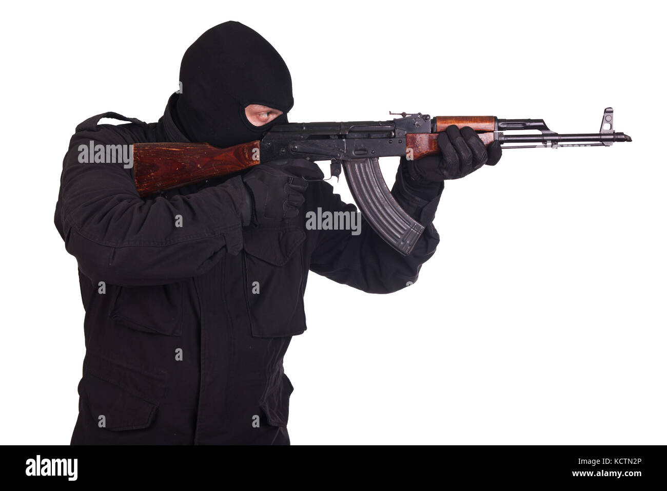 man in black uniform and mask with AK 47 gun Stock Photo - Alamy