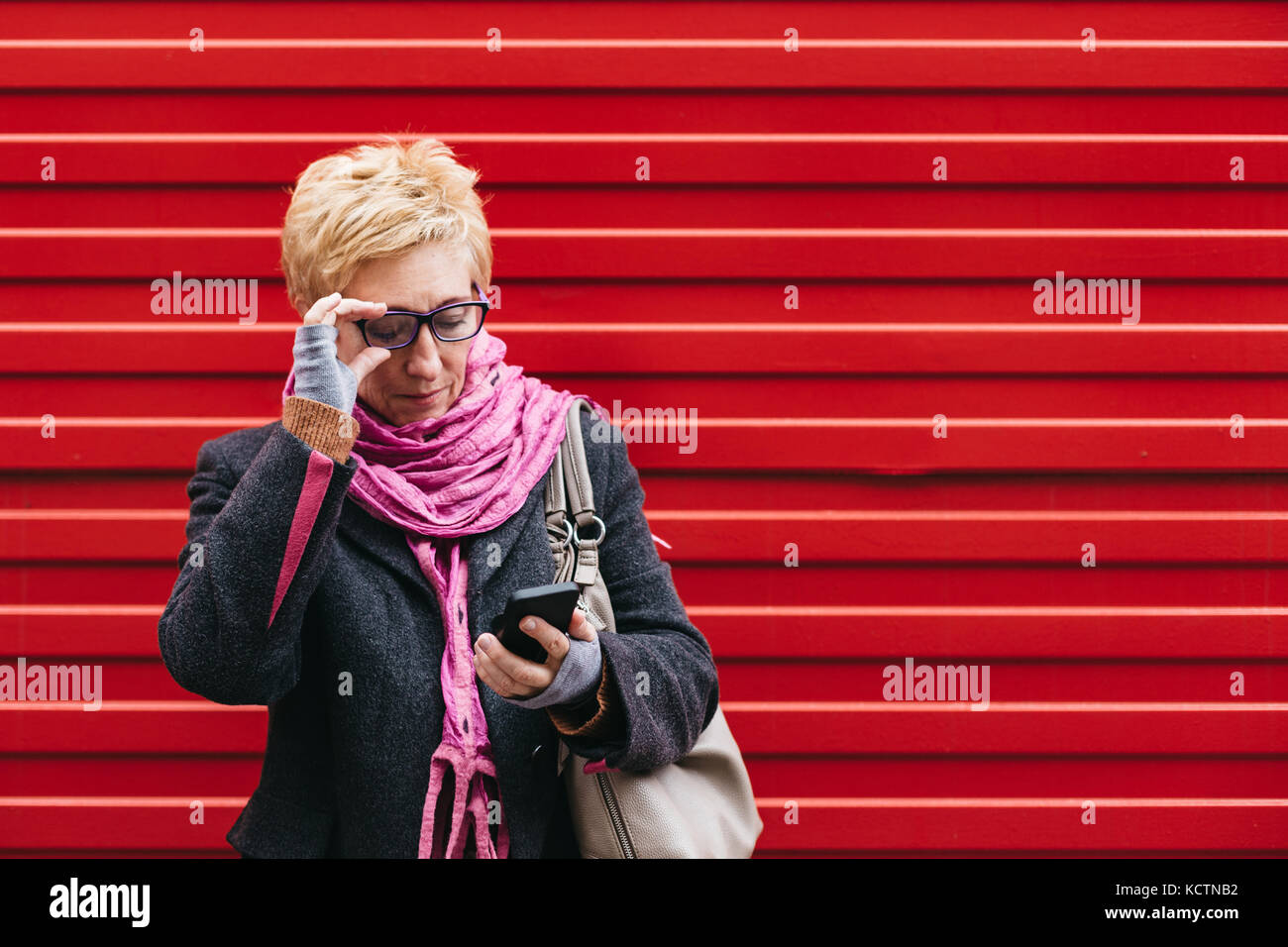 Mature woman standing street hi-res stock photography and images - Alamy