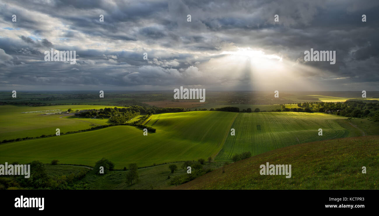Panoramic view from Dunstable Downs, Bedfordshire, UK of sun shining over fields Stock Photo
