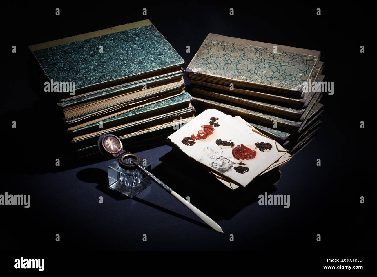 old books, papers, ink pen and inkpot on black background Stock Photo ...