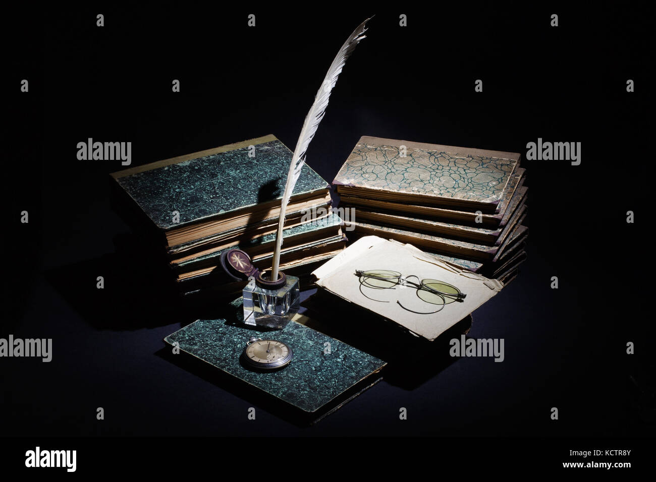 old books, papers, ink pen and inkpot on black background Stock Photo ...